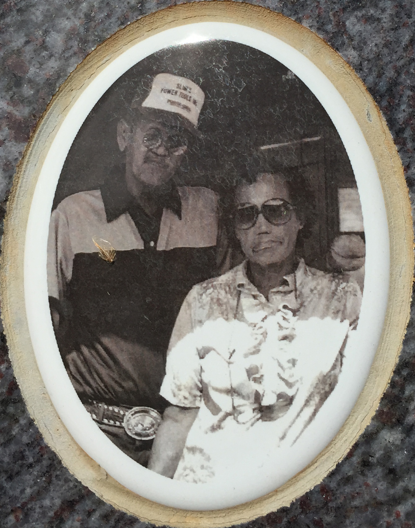 picture of man and woman on a gravestone