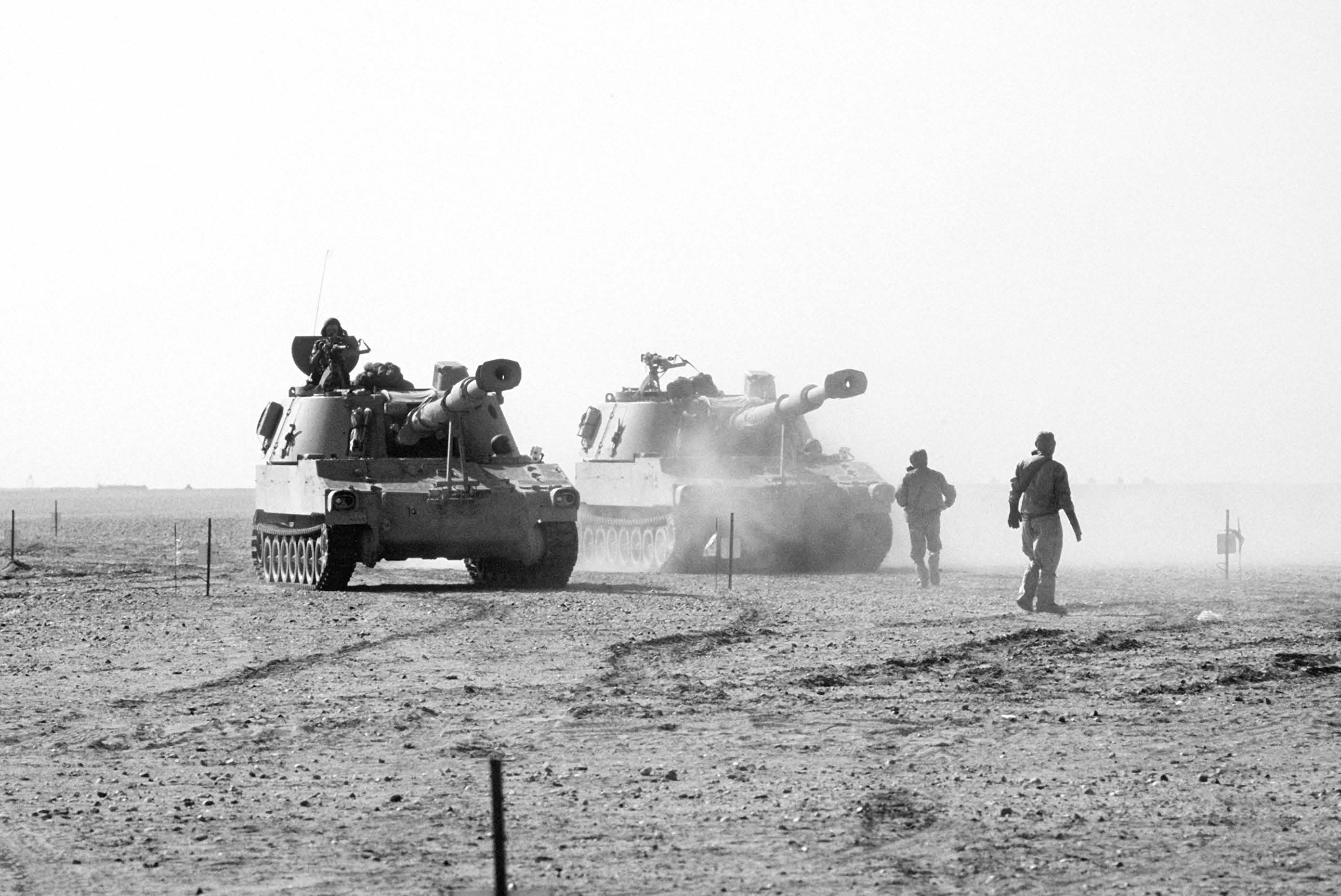 American armored vehicles move across the desert during Operation Desert Storm. Courtesy of DoD.