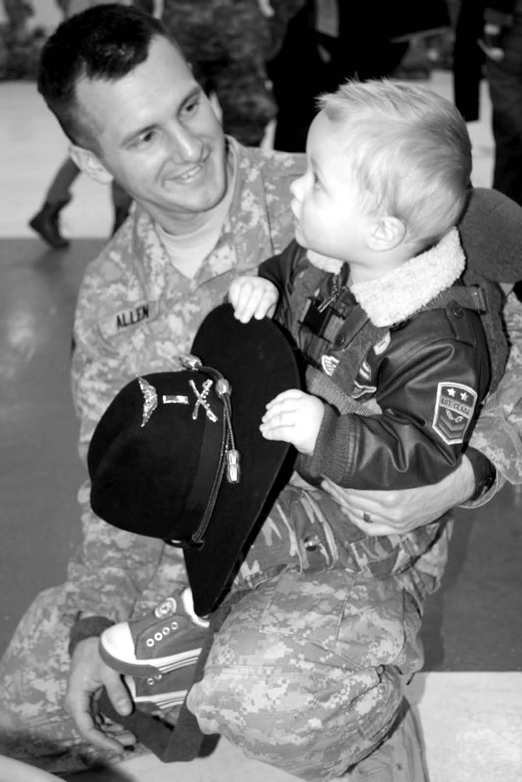 Lieutenant Chaz Allen holds his son prior to deploying to Afghanistan in 2010. Courtesy of Chaz Allen.
