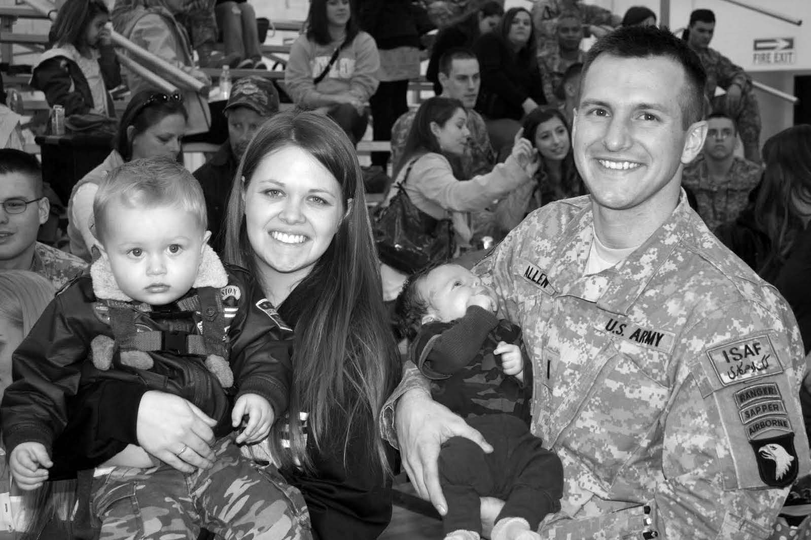 Chaz and Sara Allen comfort two of their children prior to Lieutenant Allen’s departure for Afghanistan. Courtesy of Chaz Allen.