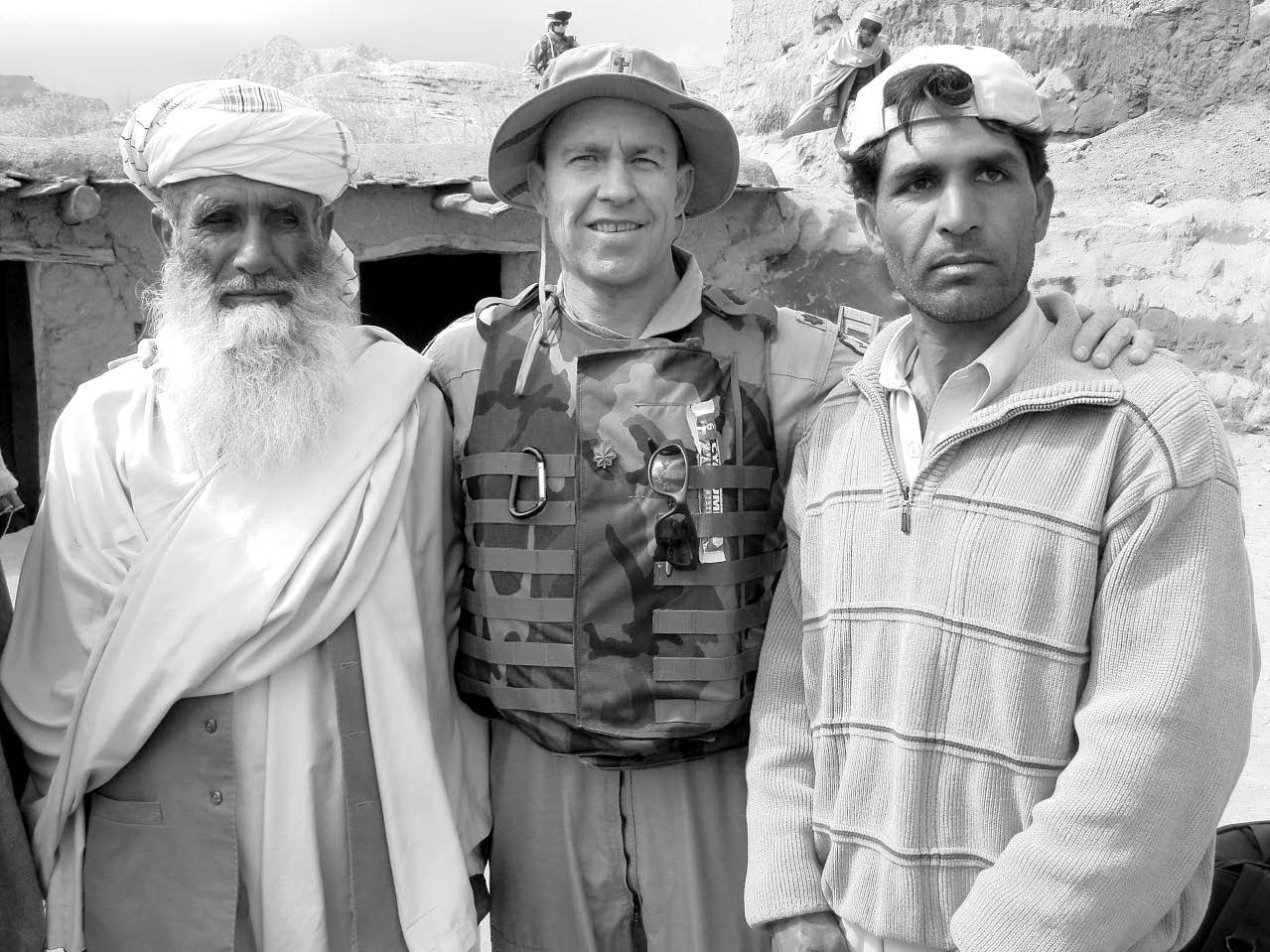 Latter-day Saint chaplain Mark Allison (center) is shown with an Afghan father and son near the border of Afghanistan and Pakistan. Courtesy of Mark Allison.