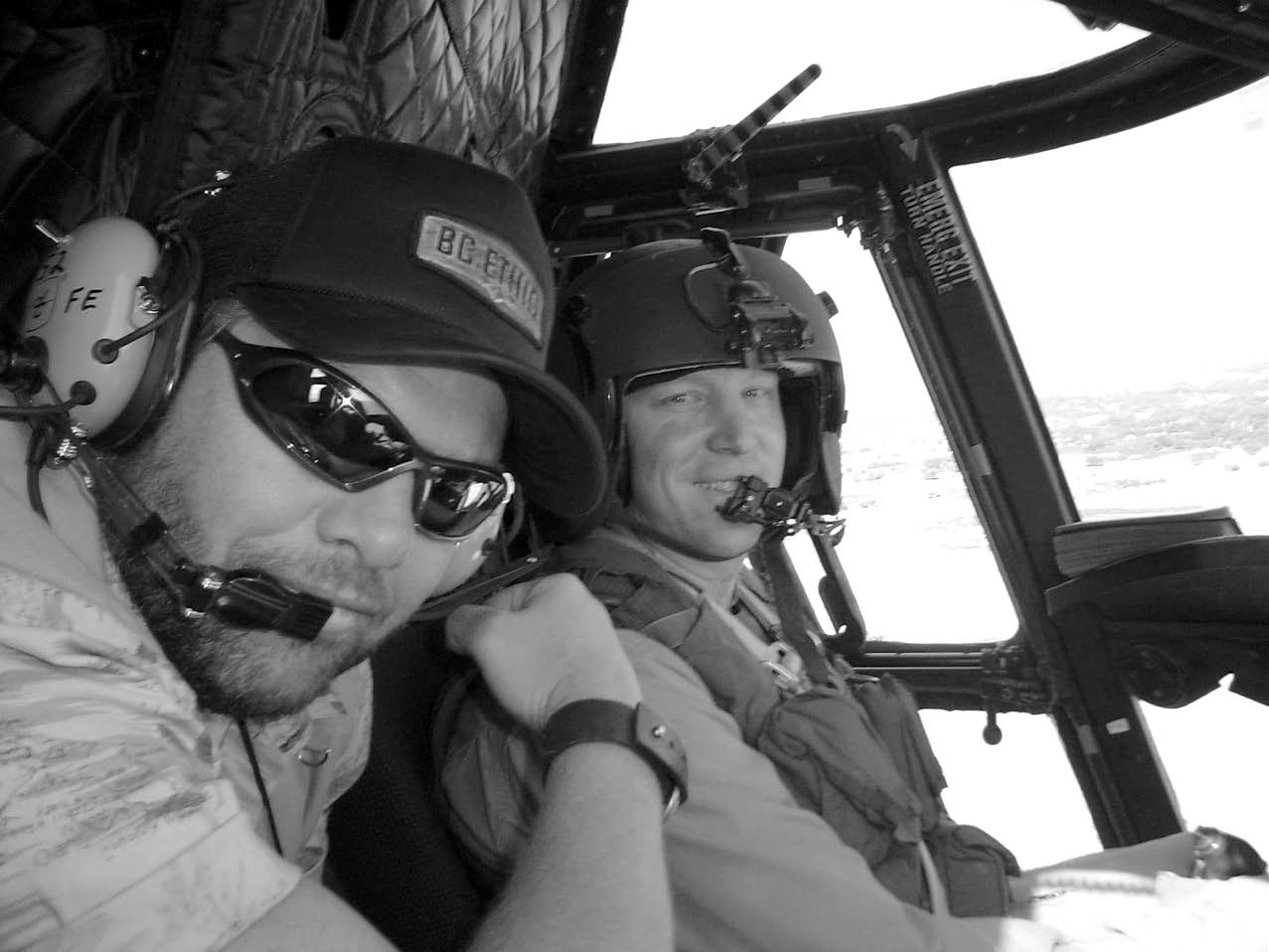 Captain Richard Holling and country singer Toby Keith are shown flying from Kabul to Bagram, Afghanistan, on June 3, 2004. Toby Keith was visiting National Guard soldiers from his home state of Oklahoma. Courtesy of Richard Bratt.