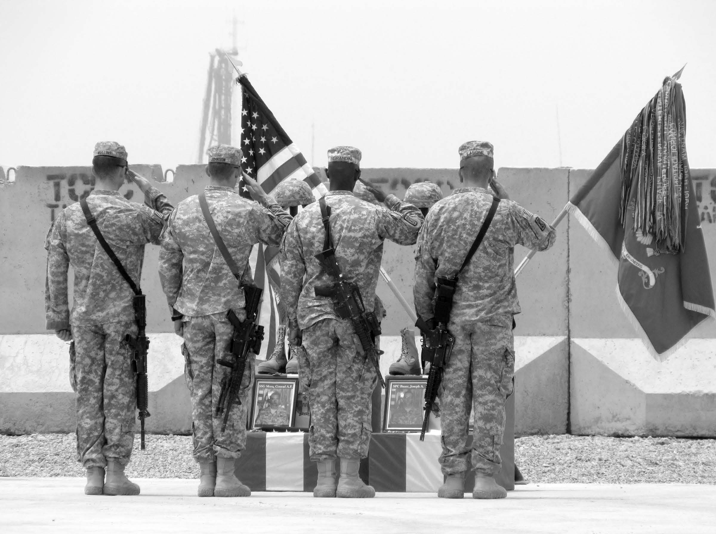 Soldiers salute their fallen comrades. Courtesy of J. Joseph DuWors.