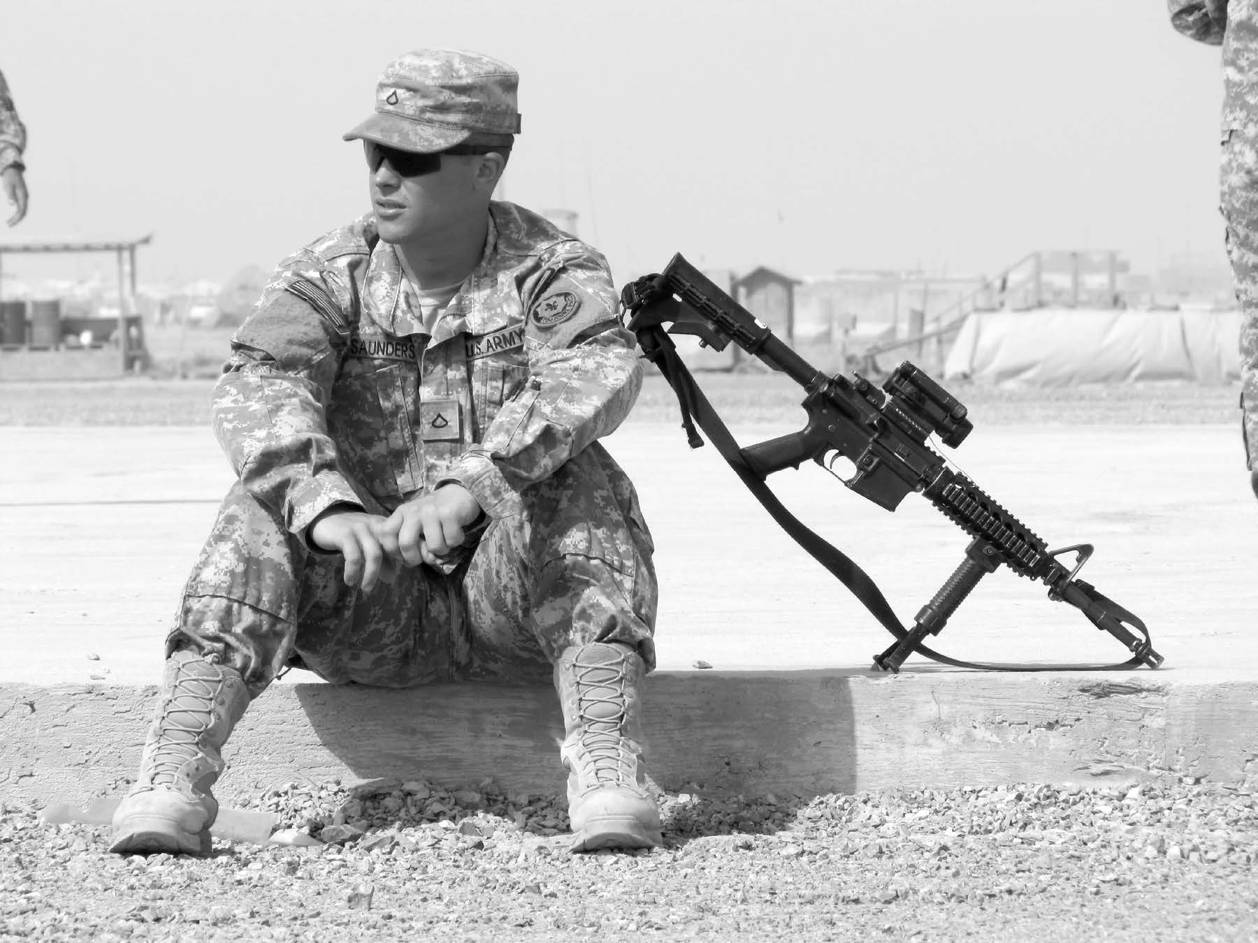 A soldier relaxes during a few minutes of quiet time. Military life in a combat zone has been described as “hours of boredom punctuated by moments of sheer terror.” Courtesy of J. Joseph DuWors.
