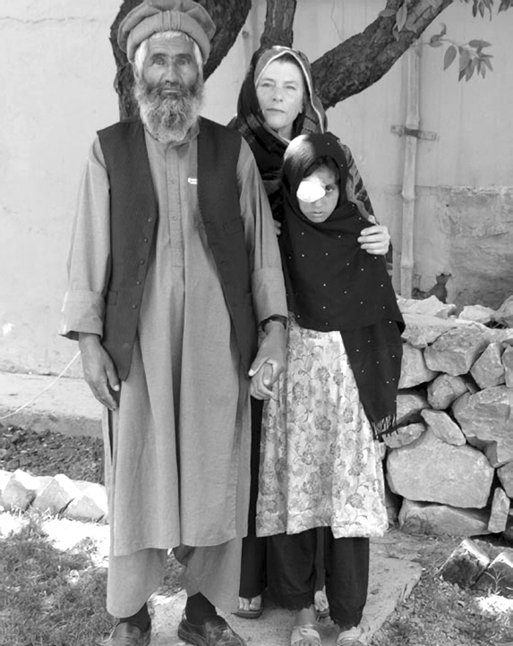 An Afghan girl and her parents are pictured following her cataract surgery. Courtesy of Layne S. Pace.
