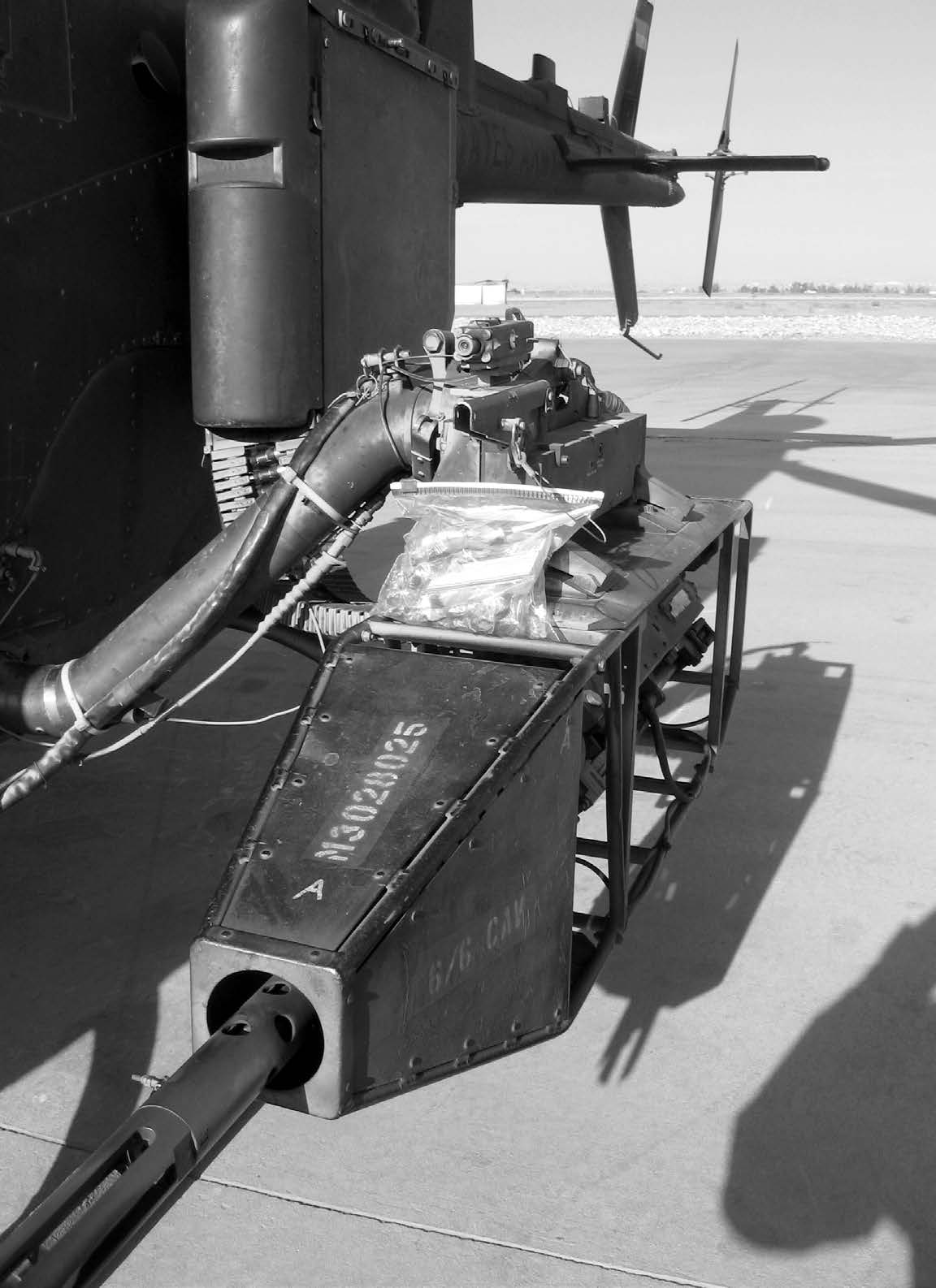 While Captain Scott P. Pace, a U.S. Army aviator, was attempting to drop candy to Afghan children from this helicopter, the bag got stuck on his left .50 caliber machine gun. Courtesy of Scott P. Pace.