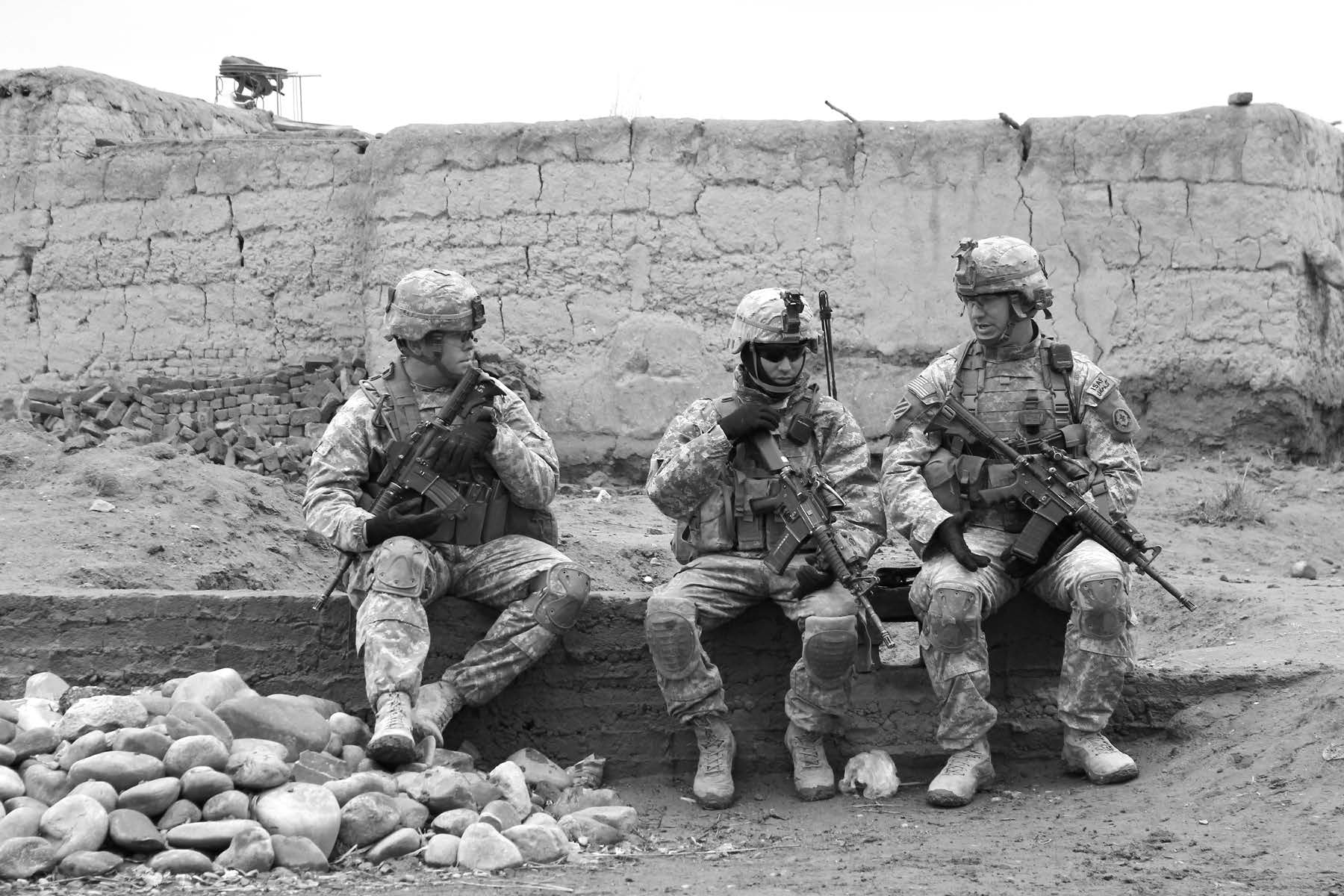 American soldiers enjoy a brief rest during a search mission. Courtesy of J. Joseph DuWors.