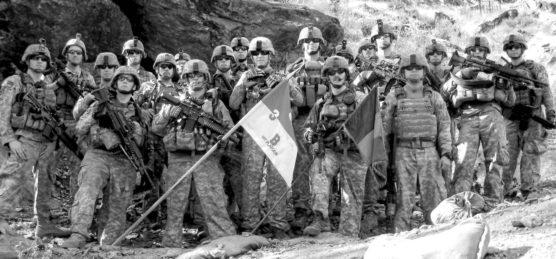 Members of Red Platoon, 3-61 Cavalry Regiment, including Staff Sergeant Clint Romesha (front row, second from right) pose for a picture in 2009 shortly after arriving at Combat Outpost Keating in Nuristan Province, Afghanistan. Courtesy of DoD.