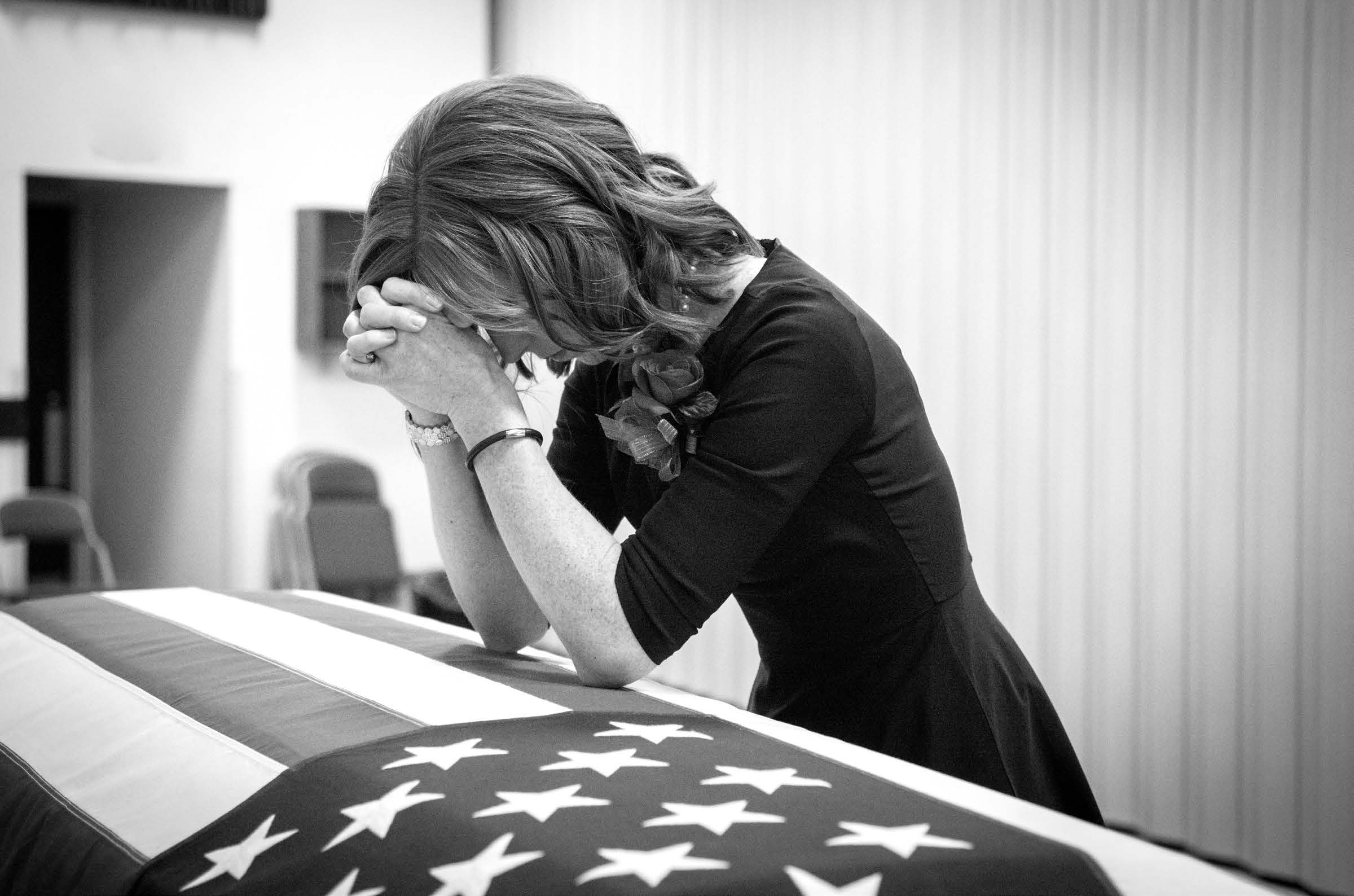Jennie Taylor at the casket of her husband, Major Brent Taylor, who was killed in Afghanistan, in November 2018. Courtesy of Westbroek Studios.