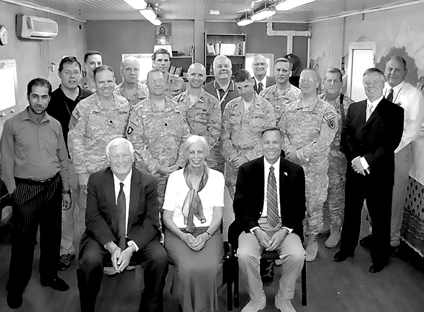 District president Gene Wikle (front row, right) and district Relief Society president Carol Thompson with members of the Kabul Military Branch. Courtesy of Eugene J. Wikle.
