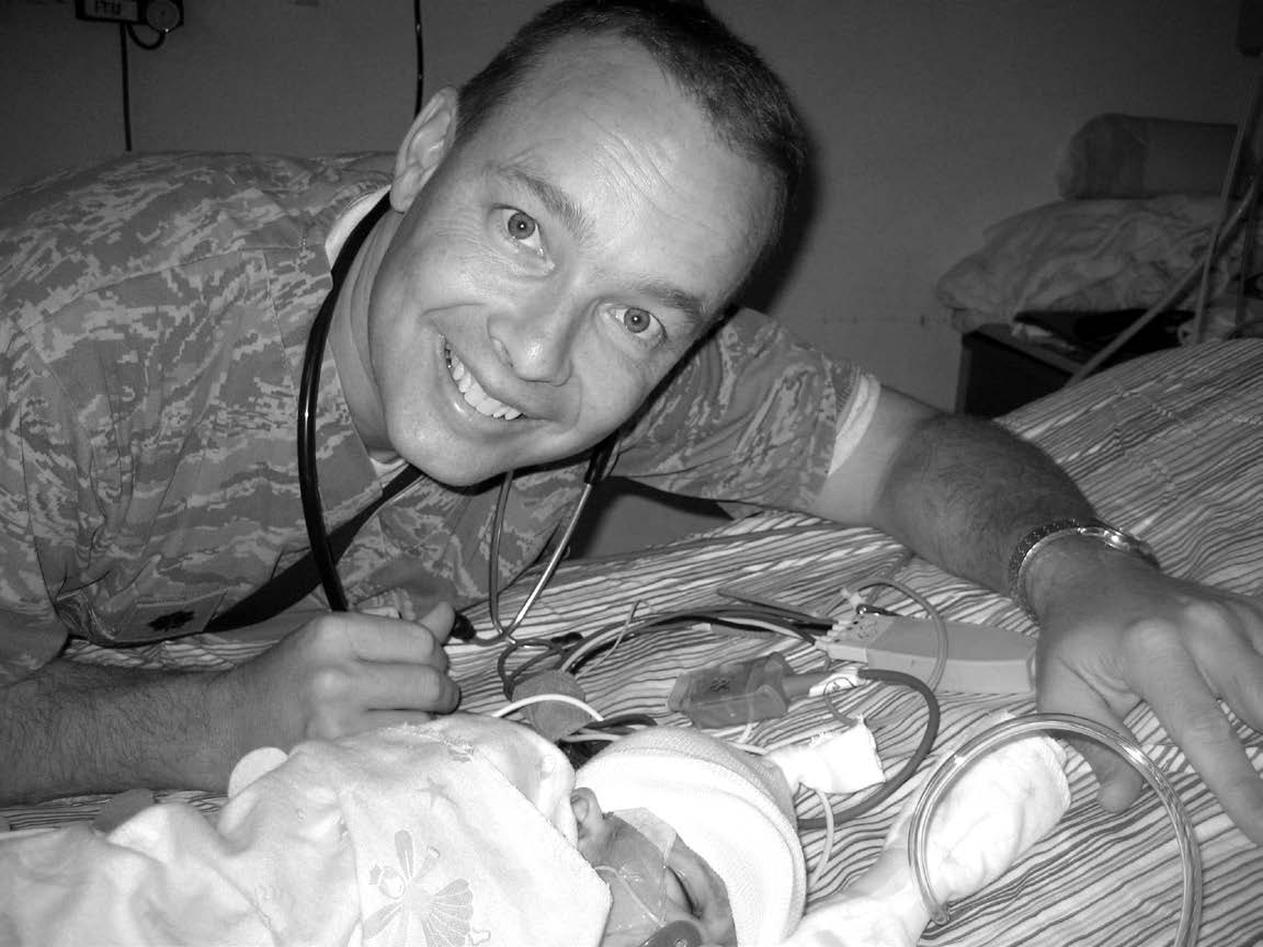 Lieutenant Colonel Blaine Tuft, taking care of a severely malnourished child in the intensive care unit at Craig Joint Theatre Hospital in Bagram during September 2010. Courtesy of Blaine Tuft.