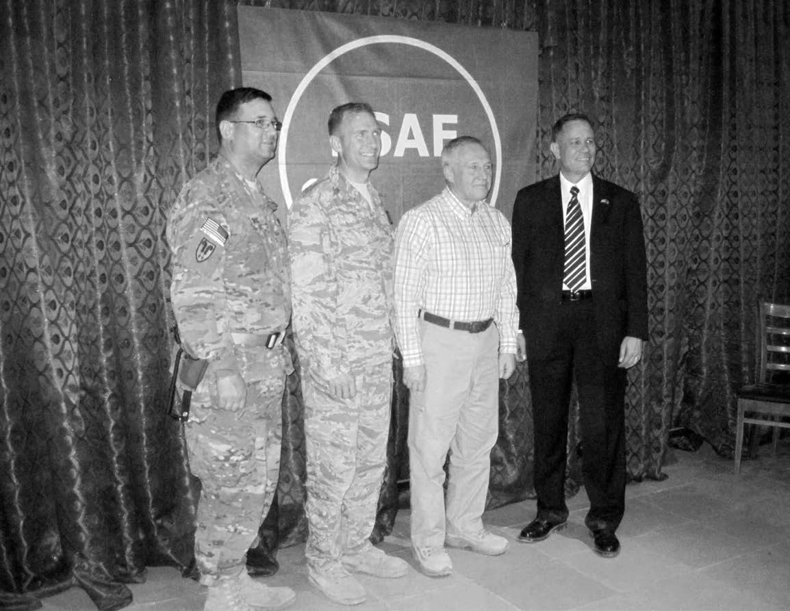 Elder Bruce A. Carlson (second from right), a General Authority Seventy and retired U.S. Air Force four-star general, visited Church members in Kabul, Afghanistan, in March 2011. Courtesy of Eugene J. Wikle.