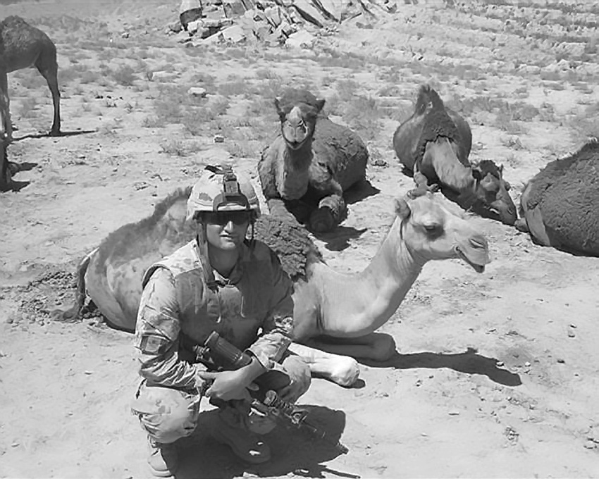Taking a break—Robert Wright with camels. Courtesy of Robert Wright.