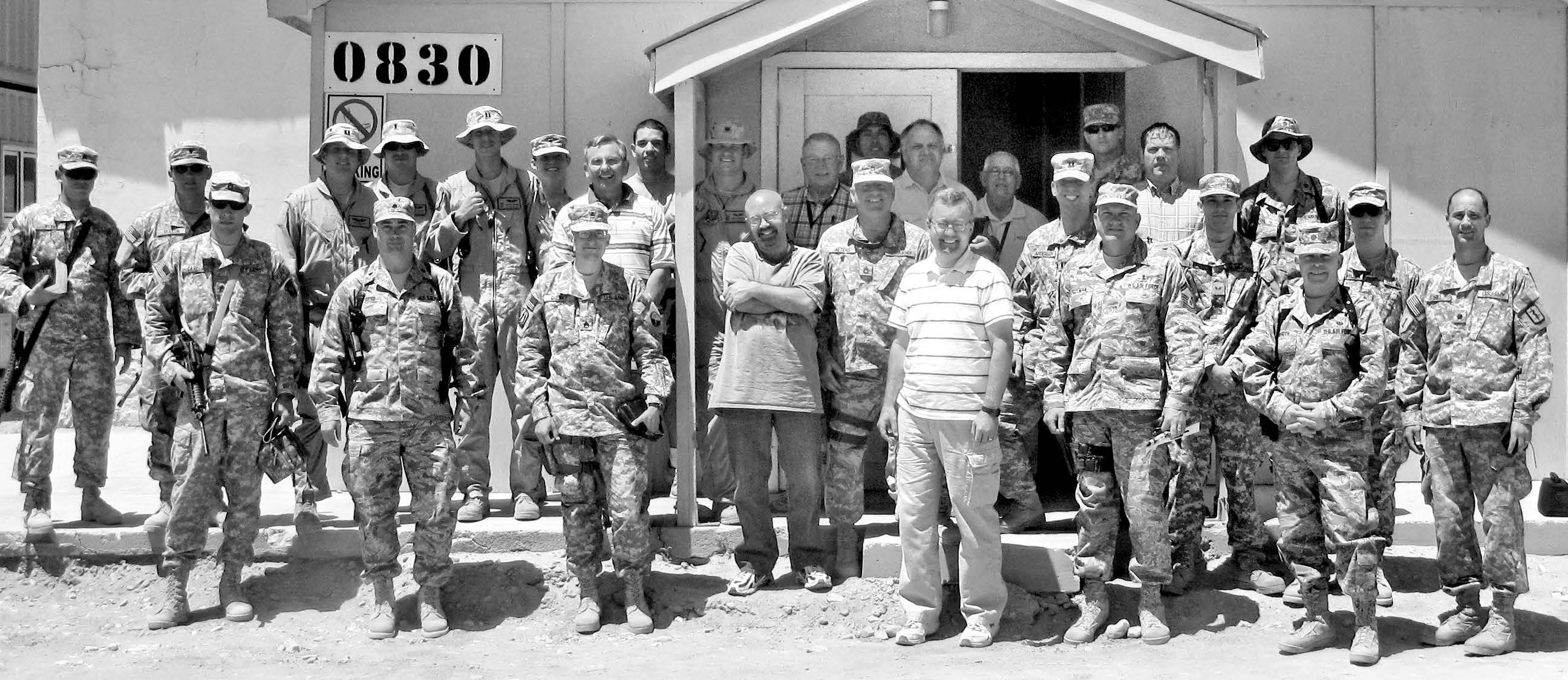 Bagram Latter-day Saint branch assembled in front of the chapel annex after church services at Bagram, Afghanistan, in July 2009. Courtesy of Richard Belcher.
