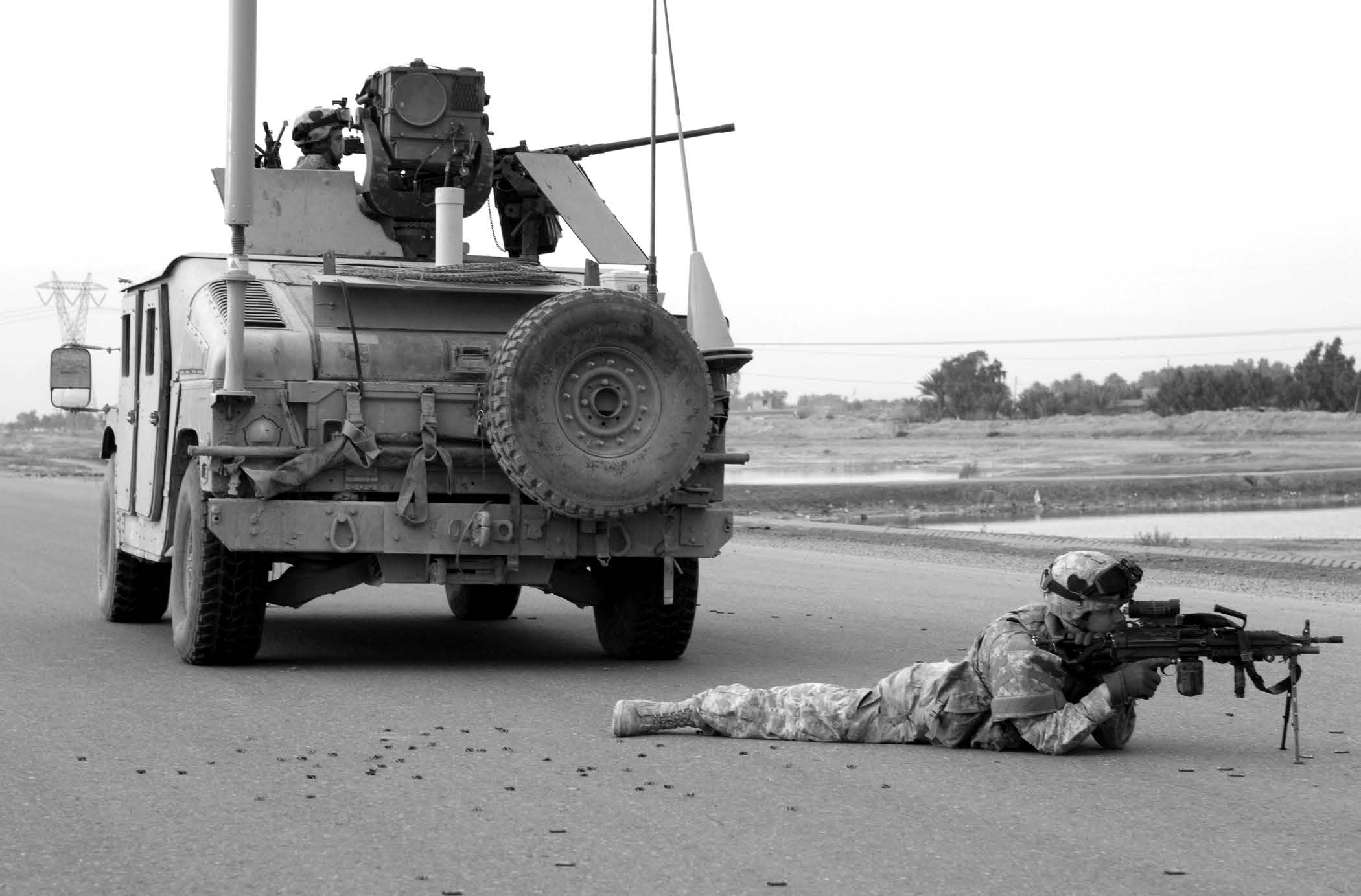 Brass shell casings lie scattered in the road as U.S. Army soldiers from the 101st Airborne Division provide security after an altercation in Baghdad, Iraq, on February 22, 2006. Courtesy of DoD.