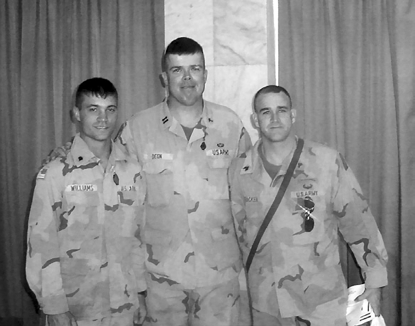 Chaplain Christopher Degn with two newly baptized members. Courtesy of Christopher Degn.