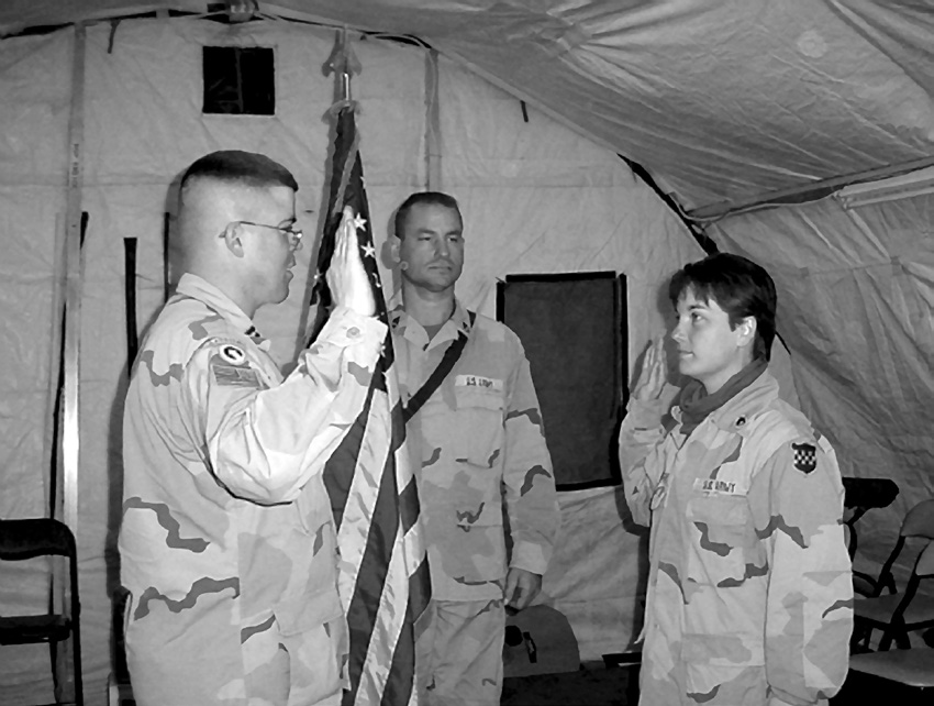 Chaplain Christopher Degn conducts a reenlistment ceremony in Iraq. Courtesy of Christopher Degn.