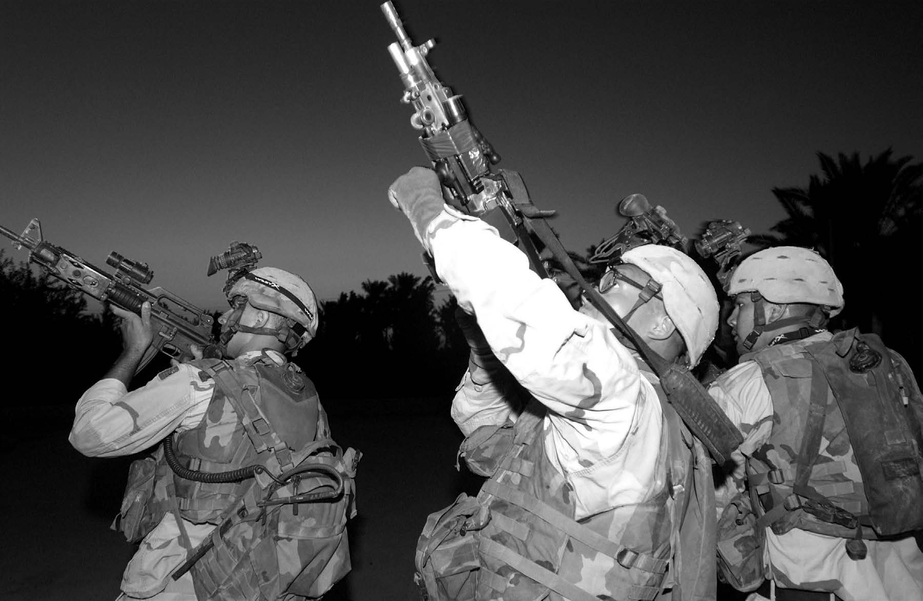 U.S. Army soldiers from the 579th Engineering Battalion secure a rooftop during a search and seizure mission in August 2004. Courtesy of DoD.