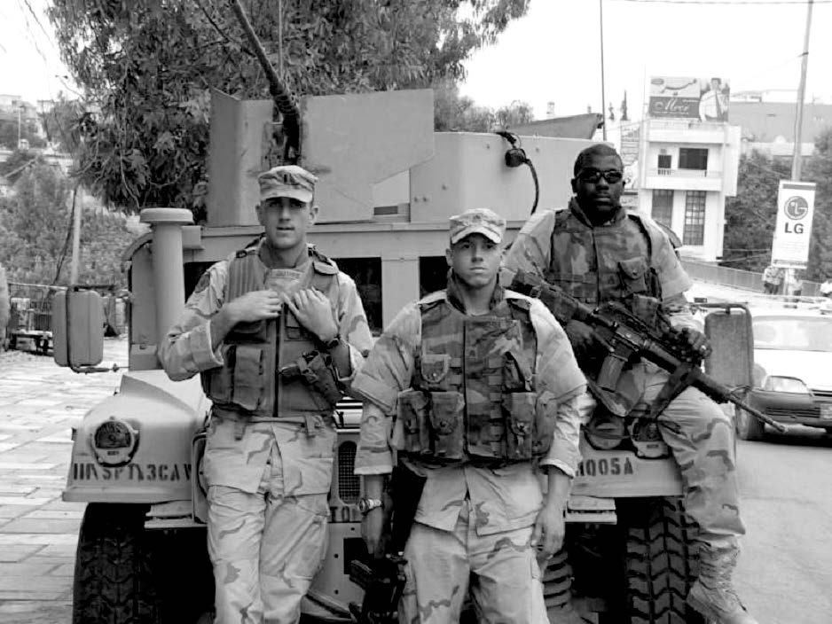 A platoon leader (left) with his driver (center) and gunner in Dahuk, Kurdistan. Courtesy of Steve Gundry.