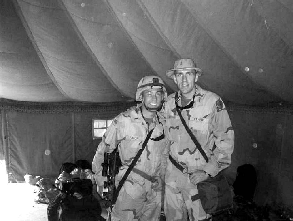 Two college roommates meet in Kuwait before each moved north with their unit toward Baghdad in the early stages of the Iraq War. Courtesy of Steve Gundry.
