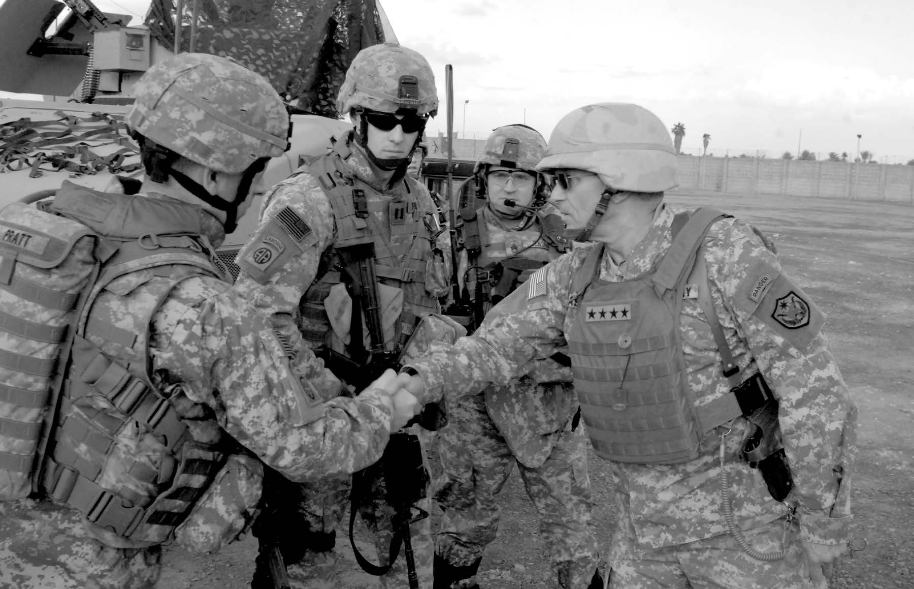 U.S. Army soldiers from the 504th Parachute Infantry Regiment shake hands with General George Casey (right), the commanding general of the multinational forces in Iraq, after a briefing at Forward Operating Base Shield in the Rusafa area of East Baghdad, Iraq, during February 2007. Courtesy of DoD.
