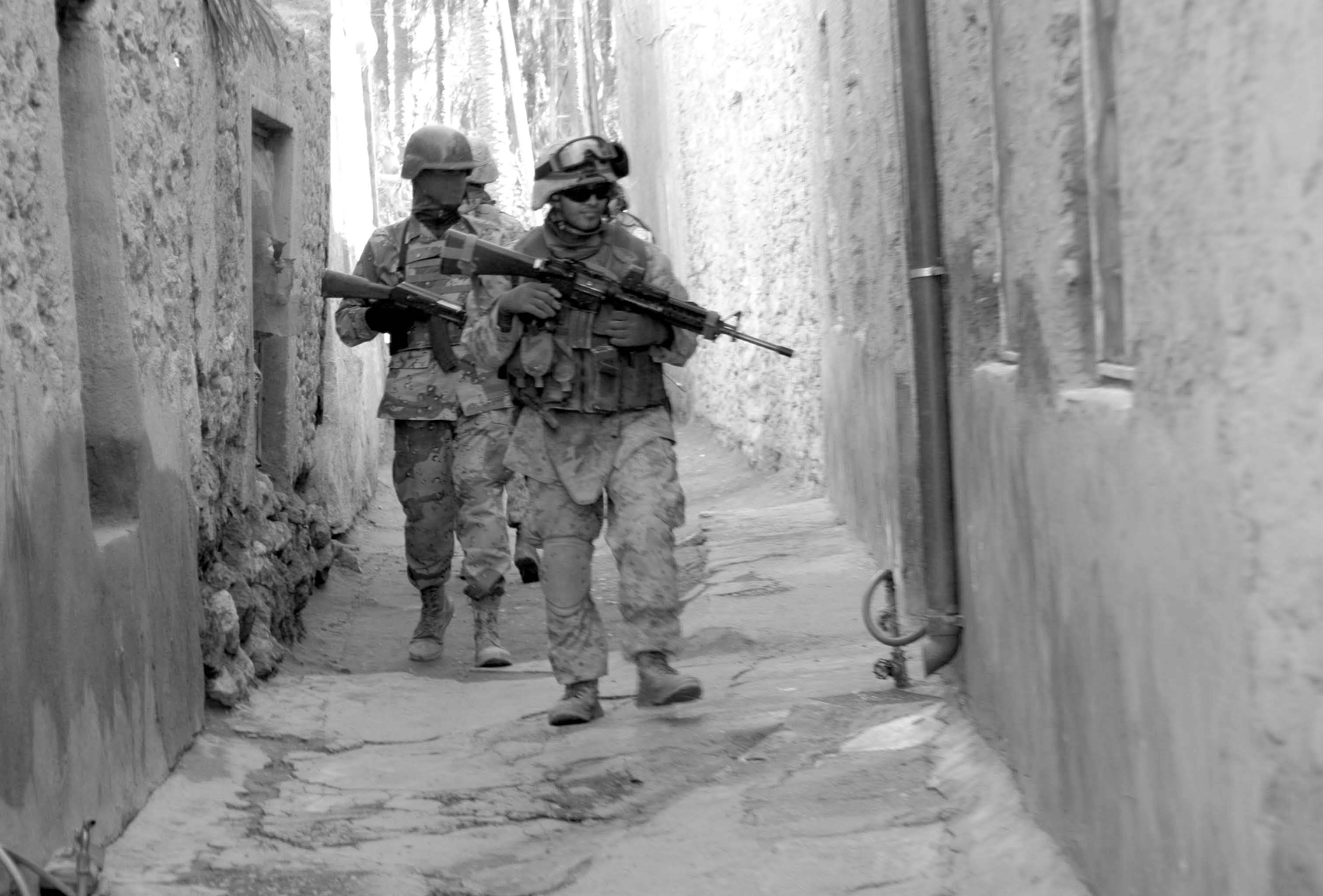 American and Iraqi soldiers conduct a security patrol through the streets of Barwana, Iraq, on January 15, 2006. Courtesy of DoD.
