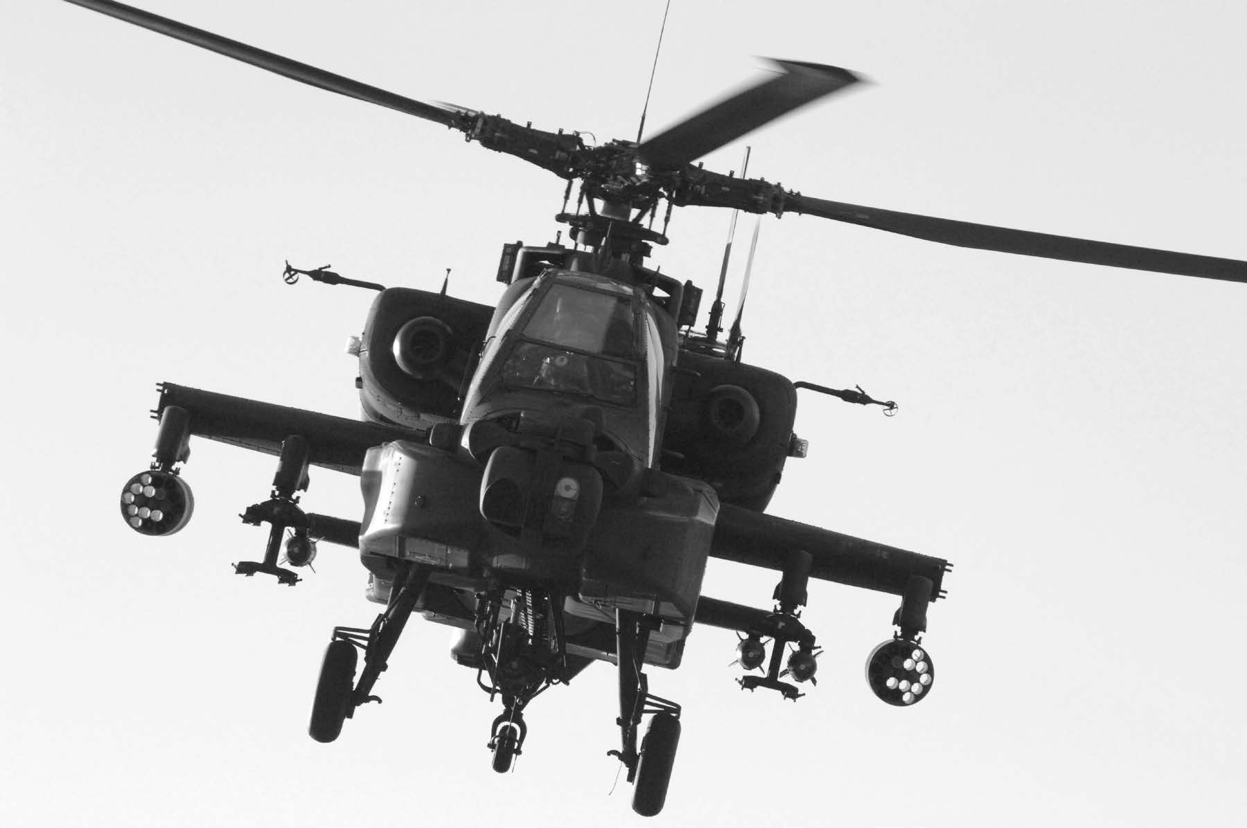 An Apache helicopter approaches a landing zone to refuel and provide air support. Courtesy of DoD.