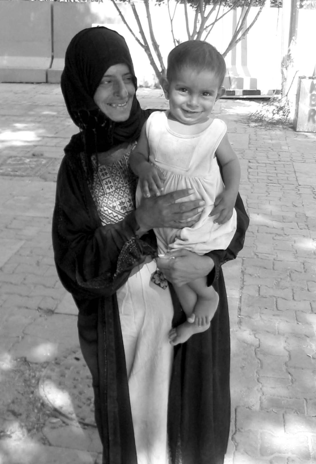 An Iraqi mother and child at a Baghdad bazaar. Courtesy of Michael McMaken.