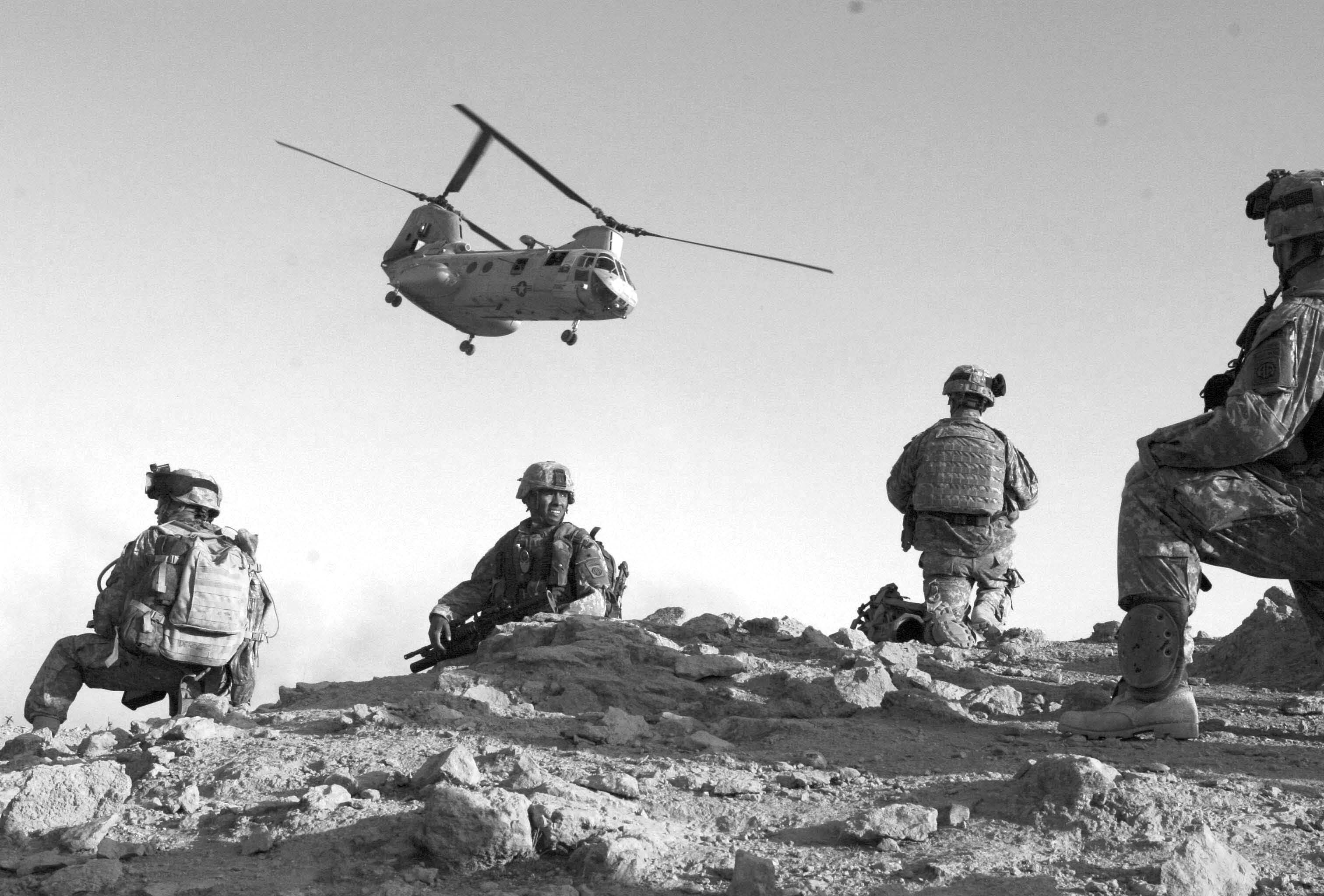 U.S. soldiers awaiting helicopter transport. Courtesy of DoD.