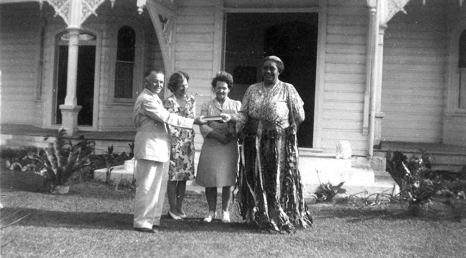 Evon and Martha Huntsman present Queen Salote with the Tongan Book of Mormon. Evon Huntsman collection courtesy of Lorraine Morton Ashton.