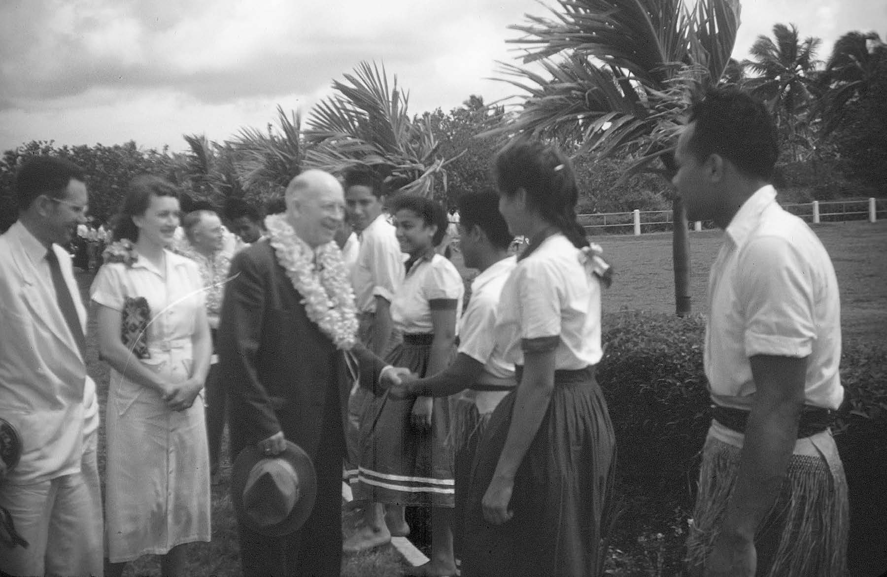 President and Sister Coombs with Elder LeGrande Richards greet Liahona students. Ross Bulkley collection courtesy of Lorraine Morton Ashton.