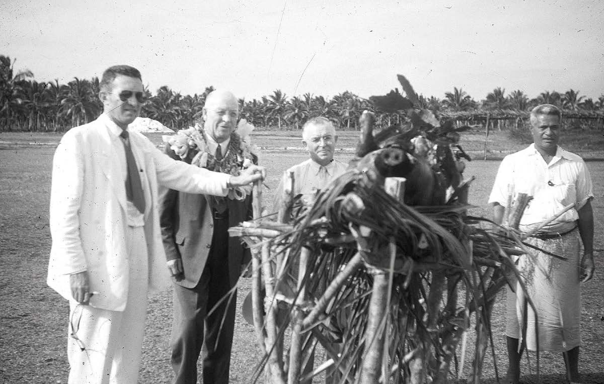 President D’Monte Coombs with Elder LeGrande Richards and Evon Huntsman inspect a puaka toho. Courtesy of Lorraine Morton Ashton.