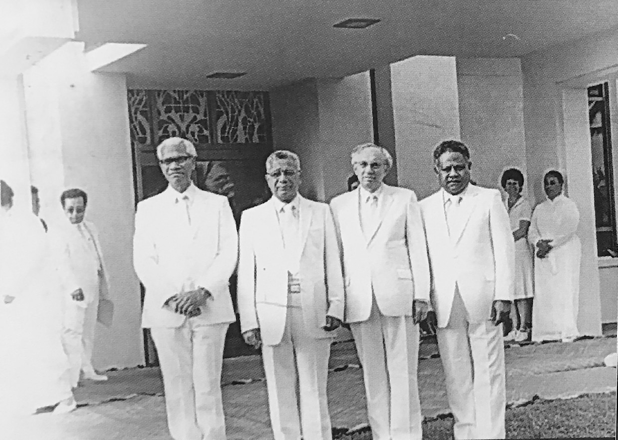 First Tongan Temple presidency: Vaha‘i Tonga 1C, President Tonga Toutai Paletu’a, President Gordon B. Hinckley, Filimoni Fie‘eiki 2C. Courtesy of Kakolosi Kioa Tu‘ione.