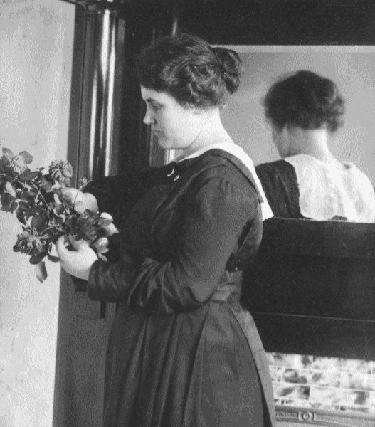 Anella Lytle Gibbons holding flowers.
