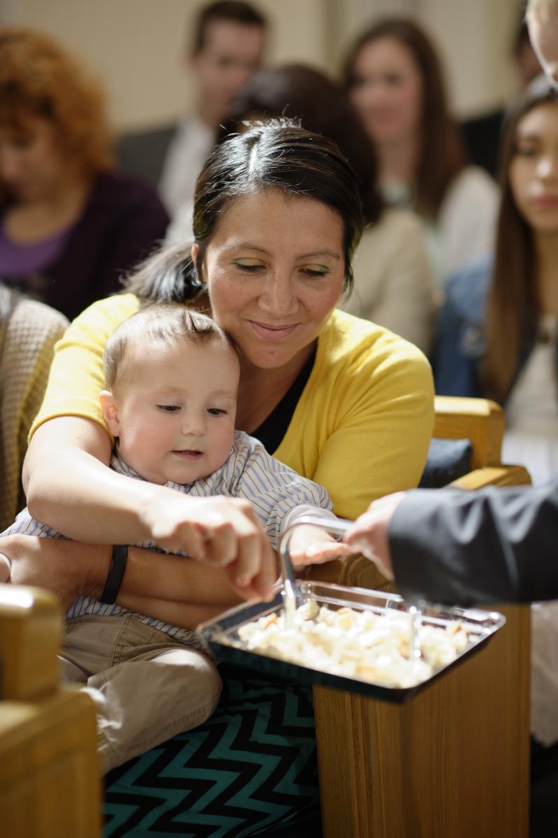 a mother taking the sacrament