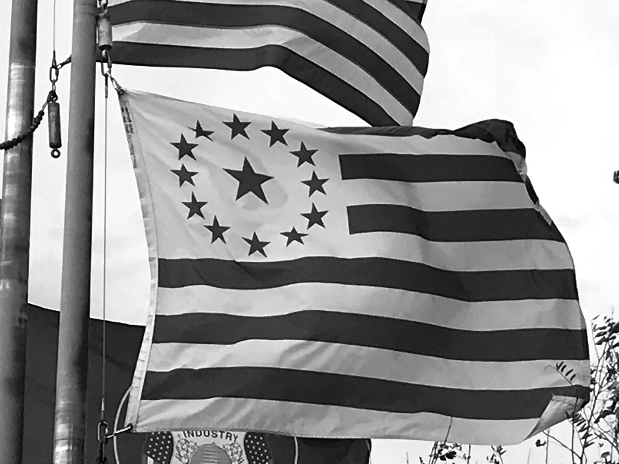 A replica of the flag of Deseret, first used in 1849, flies today at Ensign Peak alongside the US and state of Utah flags. Photo courtesy of the author.