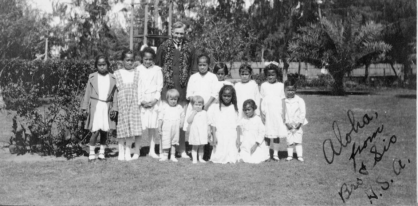 Elder David O. McKay in 1921 poses with schoolchildren in Lāʻie. Courtesy of Church History Library.