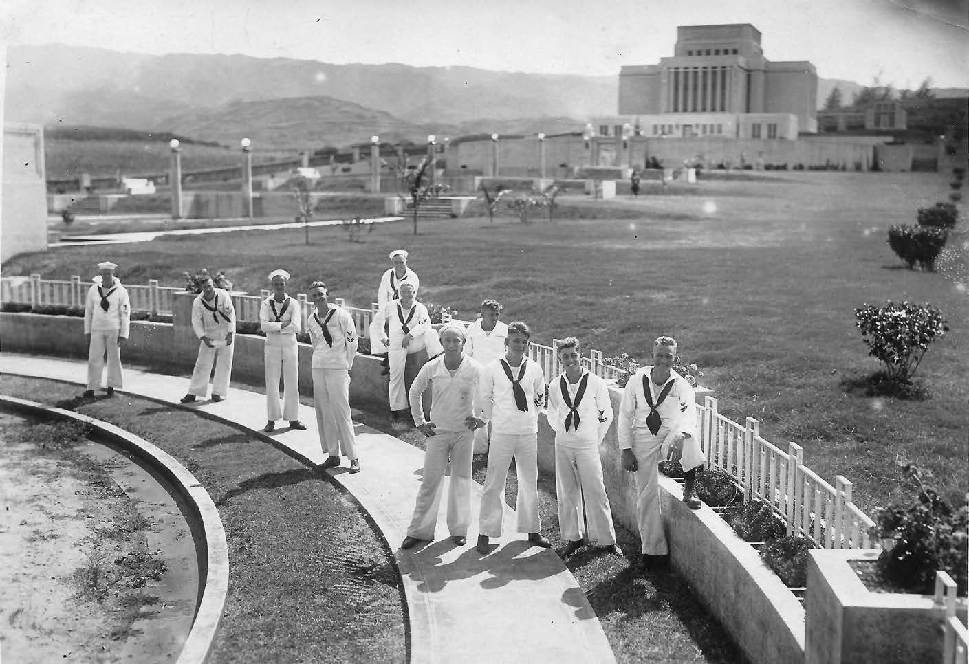 Many visitors found their way to the temple grounds, where missionaries conducted tours, answered questions, explained the gospel, and dispensed literature. Photo of sailors courtesy of Mark James. Photo of visitors courtesy of Church History Library.