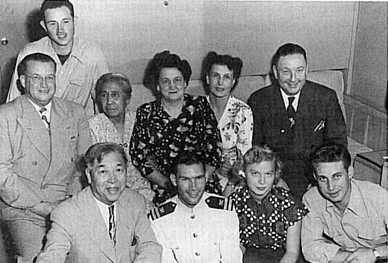In 1919 President Waddoups recorded in his journal that Henry Aki was the first Chinese person to receive his temple endowment. In 1949 the Akis were among those sent to establish missionary work in China. Second row, from left: Hilton Robertson, Sai Lang Aki, Hazel Robertson, Elva and Matthew Cowley. First row: Henry Aki (far left), Carolyn Robertson (center). The three others were crew members of the USS President Cleveland, docked in Hong Kong at the time. Courtesy of John Aki.