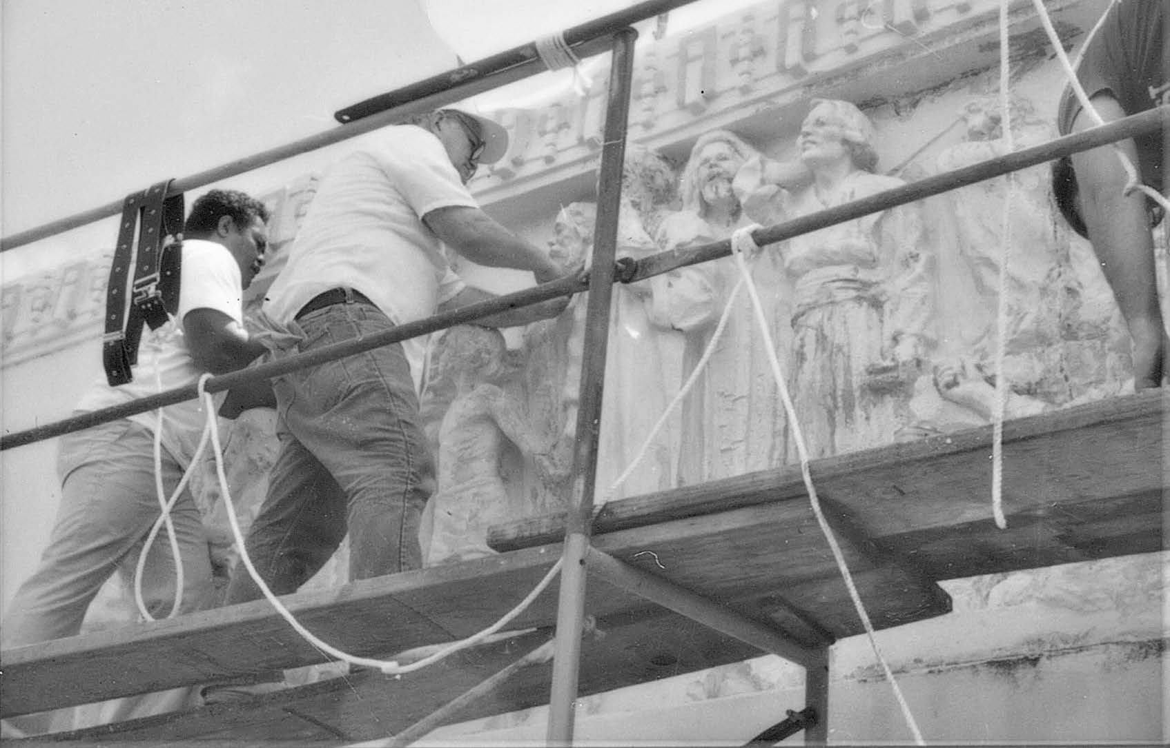 Removing layers of old paint during the 1987 restoration of the friezes, the craftsmen uncovered “a veiled masterpiece.” Courtesy of BYU–Hawaii Archives.