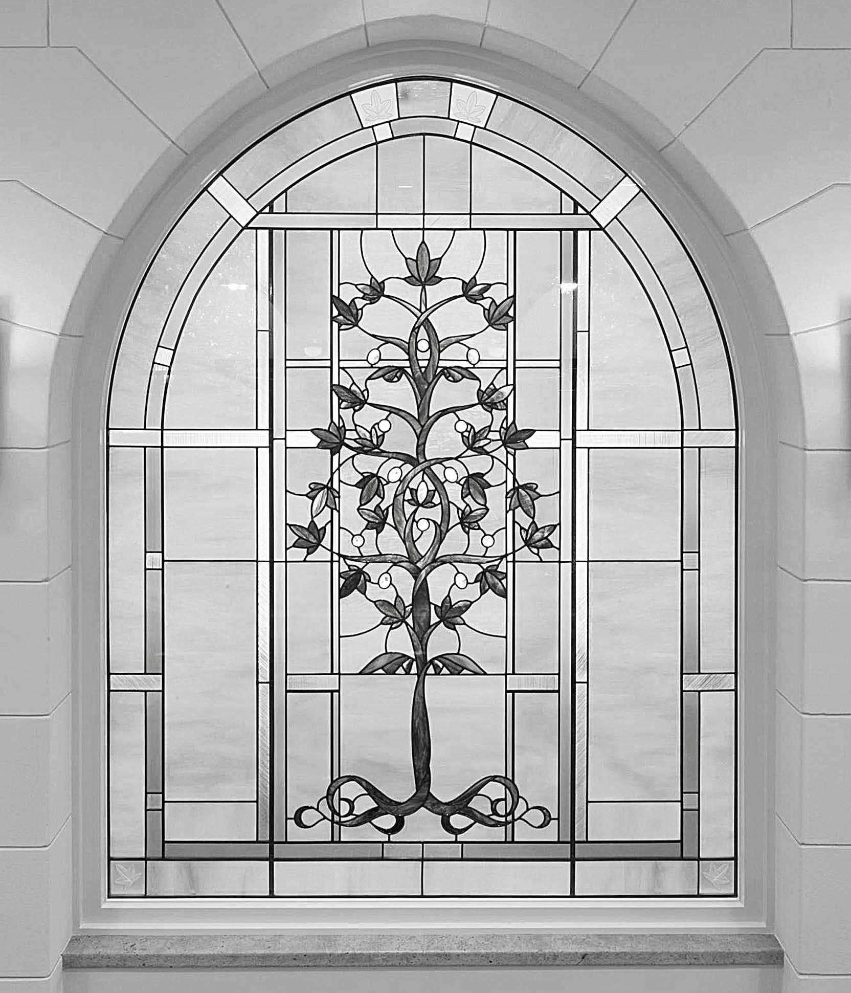 Glass art depicting the kukui tree (chosen for its historical significance in the Hawaiian culture) was added to the baptistry to emphasize the theme of partaking and sharing of the tree of life. © IRI. Used with permission.