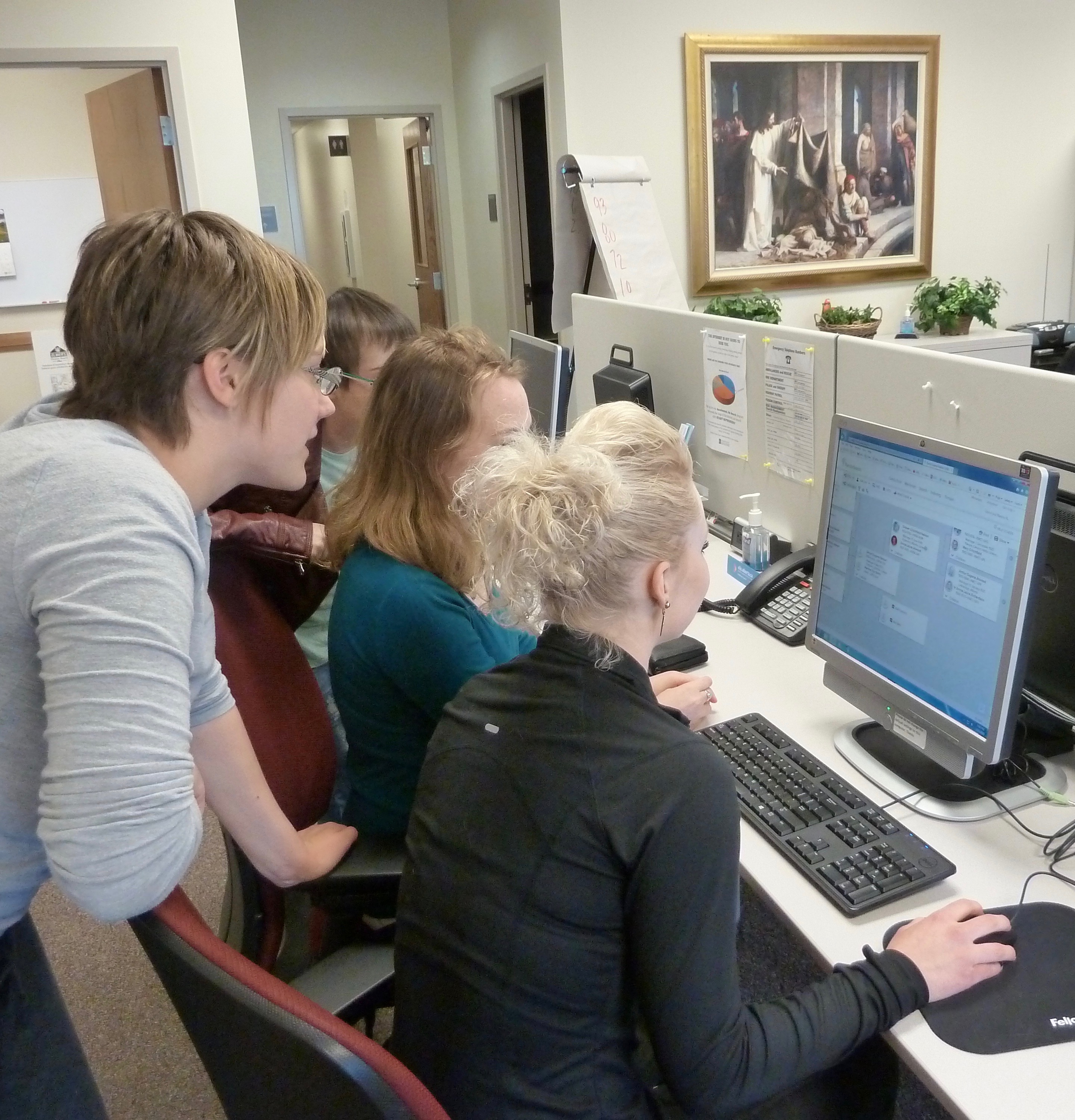several youth at computers indexing