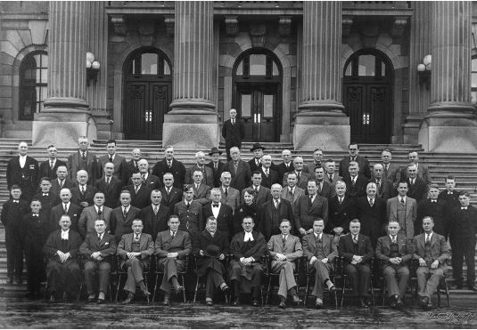 many men sitting together on stairs