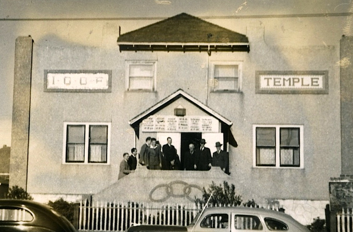 small building with people on the porch