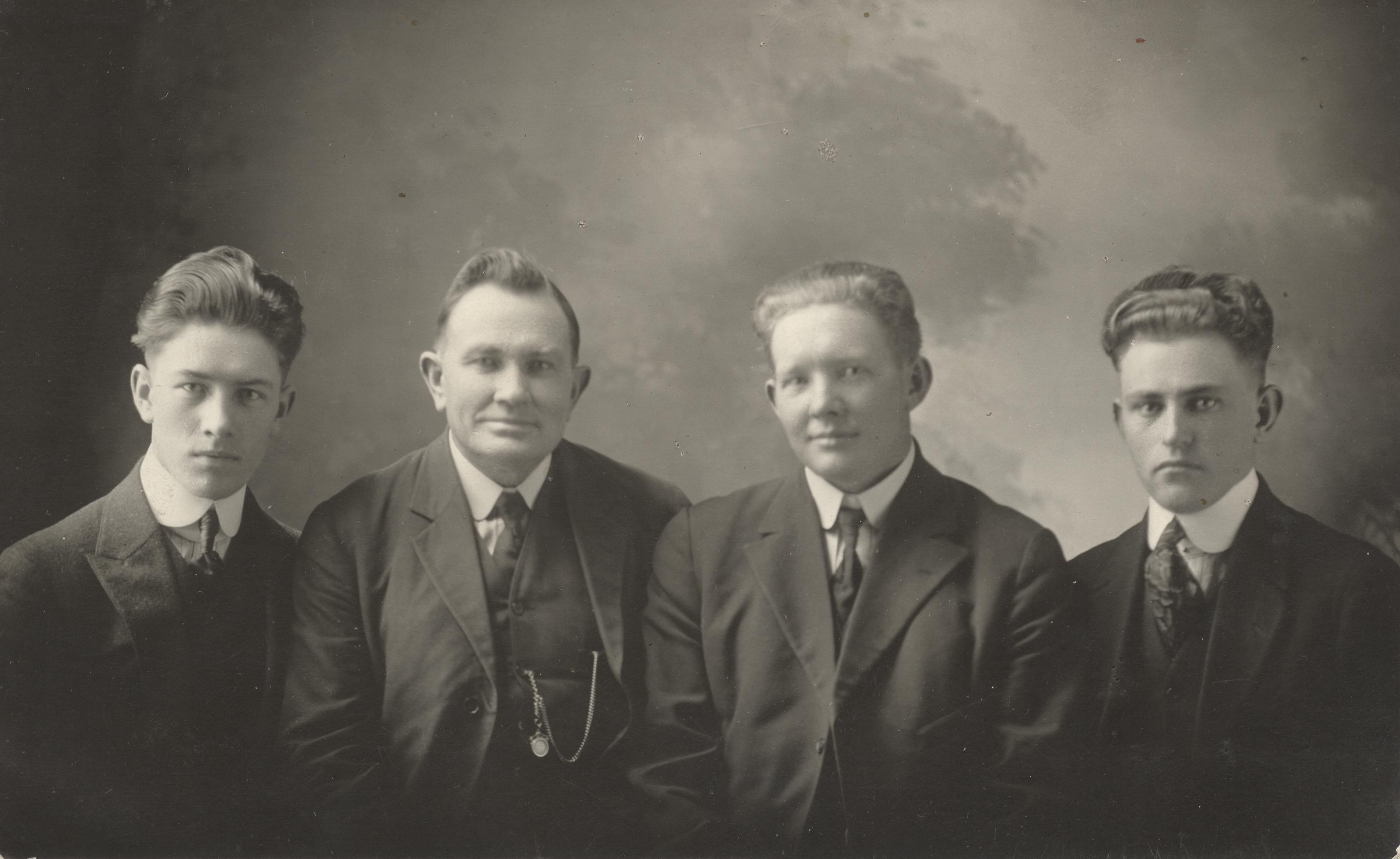 Four men in suits