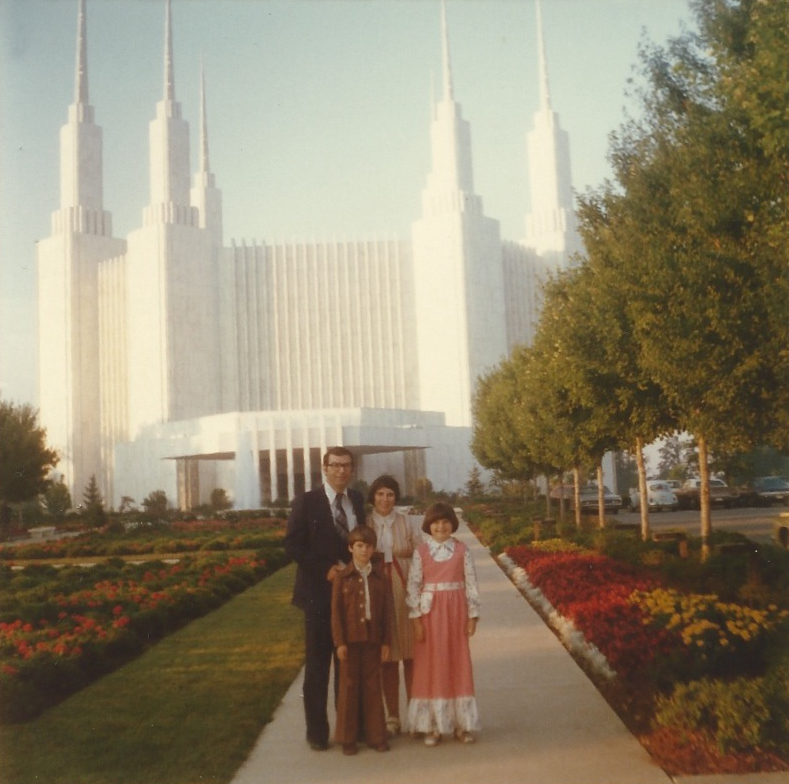 family of four outside the temple