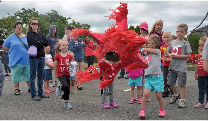 Children gathered around a pinata