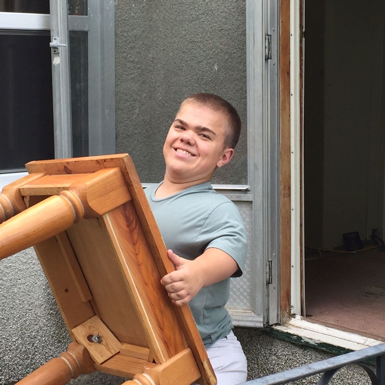 a man carrying a table