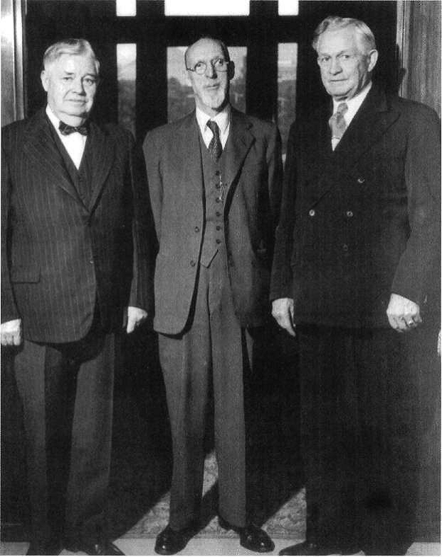 three men standing