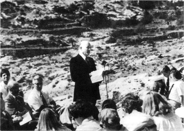 President Howard W. Hunter teaching out of the Scriptures on the Mount of Olives.